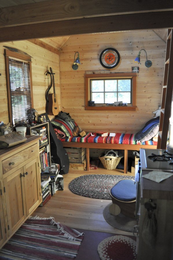 Inside a tiny home — compact living space with wood finishes